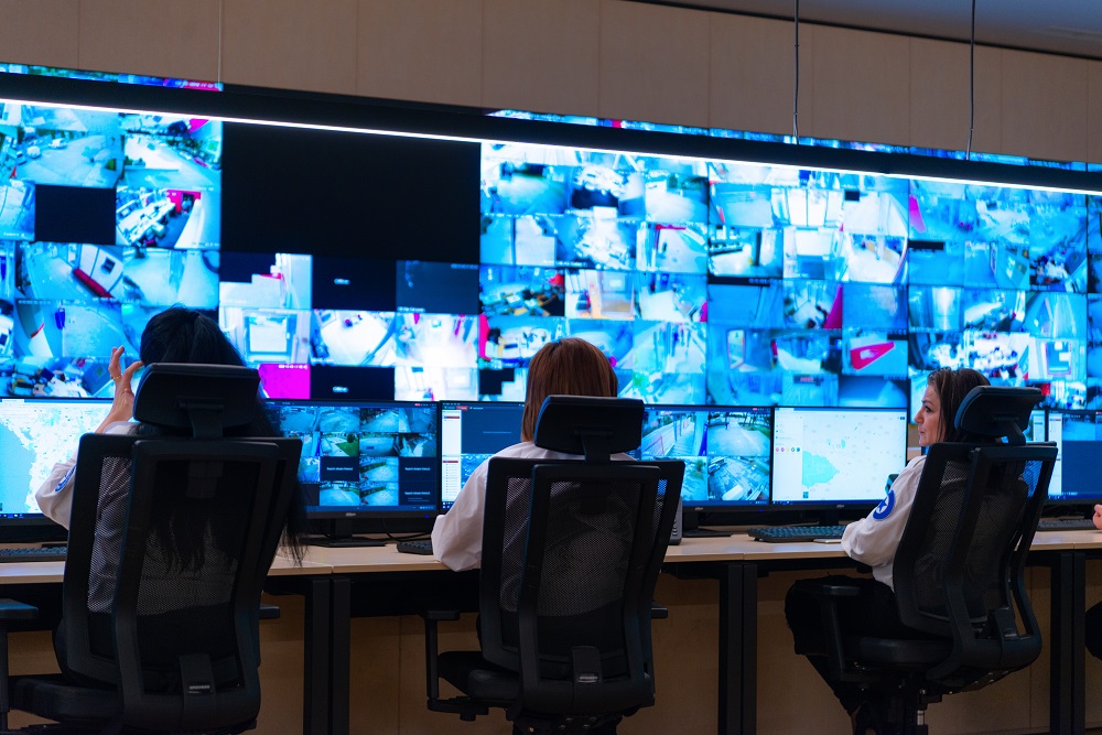 control room, Team of secret agents in uniforms, monitoring cyber, video and communications at the main control data center station.