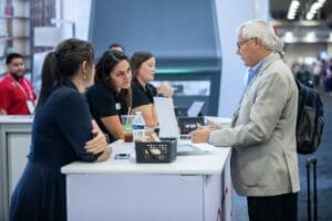 People interacting at booth sessions.