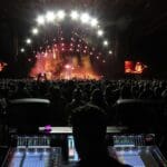 Person operating DiGiCo console at Maroon 5 concert.