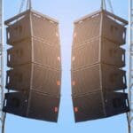 Black speaker hanging on a stand / Sound System in concert. Clipping path.