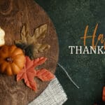 Happy Thanksgiving flat lay background with fall season decoration. Top view of pumpkins and leaves with rustic moody autumn style