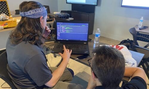 Programmers working at FarmAssist technical services division.