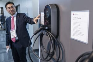 Person with LG EV charging station.