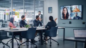 People in conference rooms using Zoom.