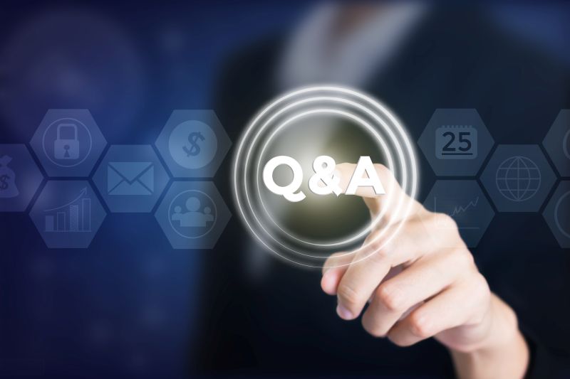 Business woman holding posts in Q&A. Can be used in advertising.