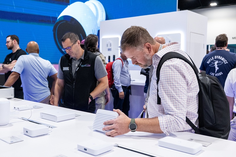 CEDIA Expo/CIX 2025 show floor with attendees at booths.
