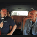 Jim Garrett and Josh Cooperman sitting inside the podcast van