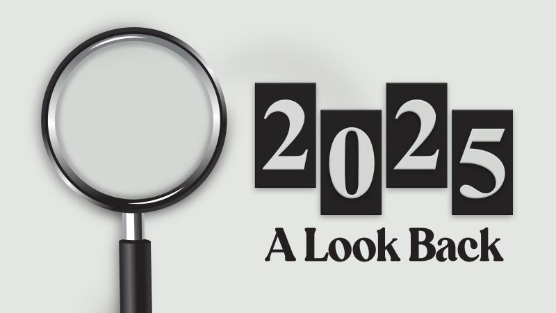Minimalist design with a magnifying glass highlighting bold “2025” text and “A Look Back” below, set on a clean light gray background, symbolizing review, reflection, and analysis.