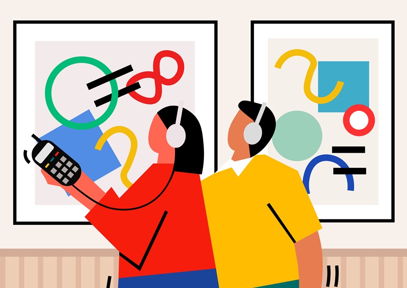 People using assistive listening guide in museum.