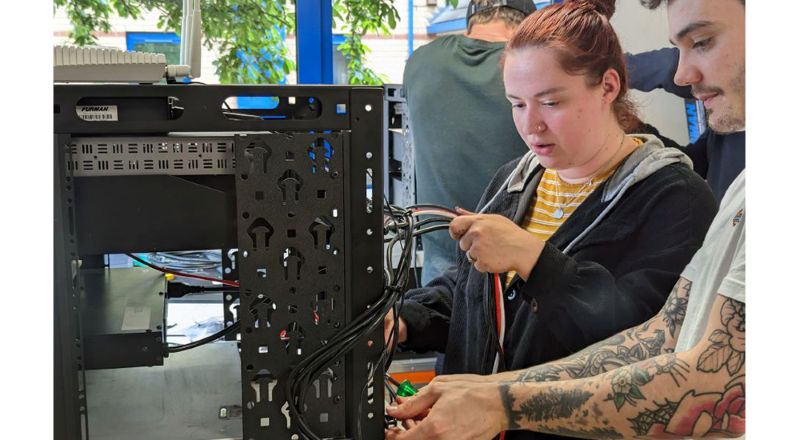 Two technicians learning to assemble a rack during CEDIA's 100 Techs in a 100 Days initiative, which ran last year. Photo courtesy of CEDIA