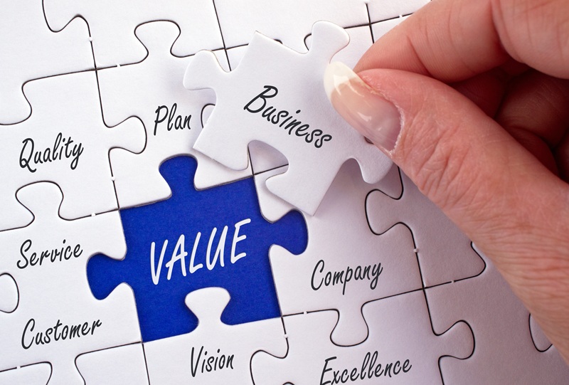 Jigsaw puzzle piece labelled "Business" over puzzle slot "Value"