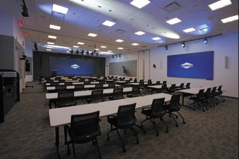 Inside Extron's award-winning Anaheim hybrid event space, built with 13 Panasonic PTZ cameras for broadcast-quality production.